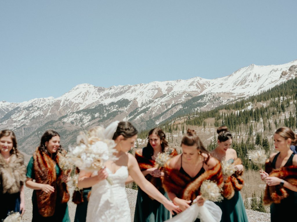 wedding party celebrates in the rocky mountains