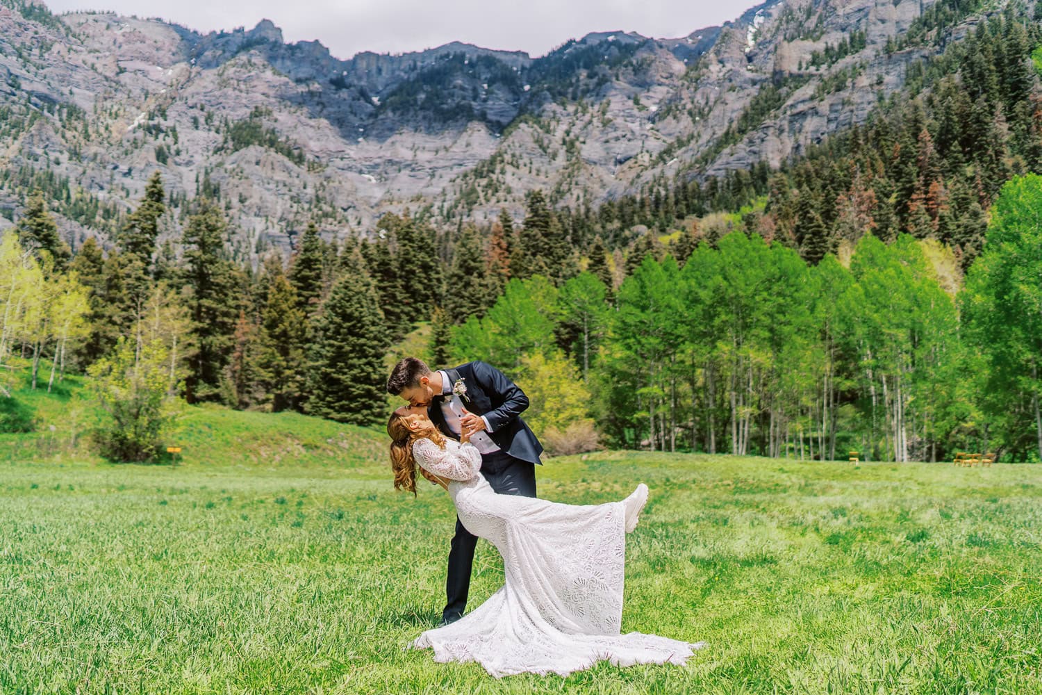 beautiful bride and groom pose in the Rocky Mountains outside Ouray, Colorado for a photo