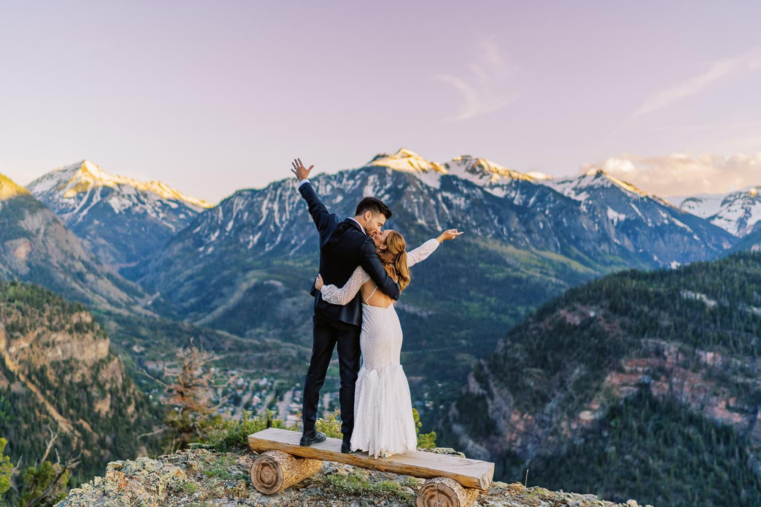 beautiful bride and groom pose in the Rocky Mountains outside Ouray, Colorado for a photo