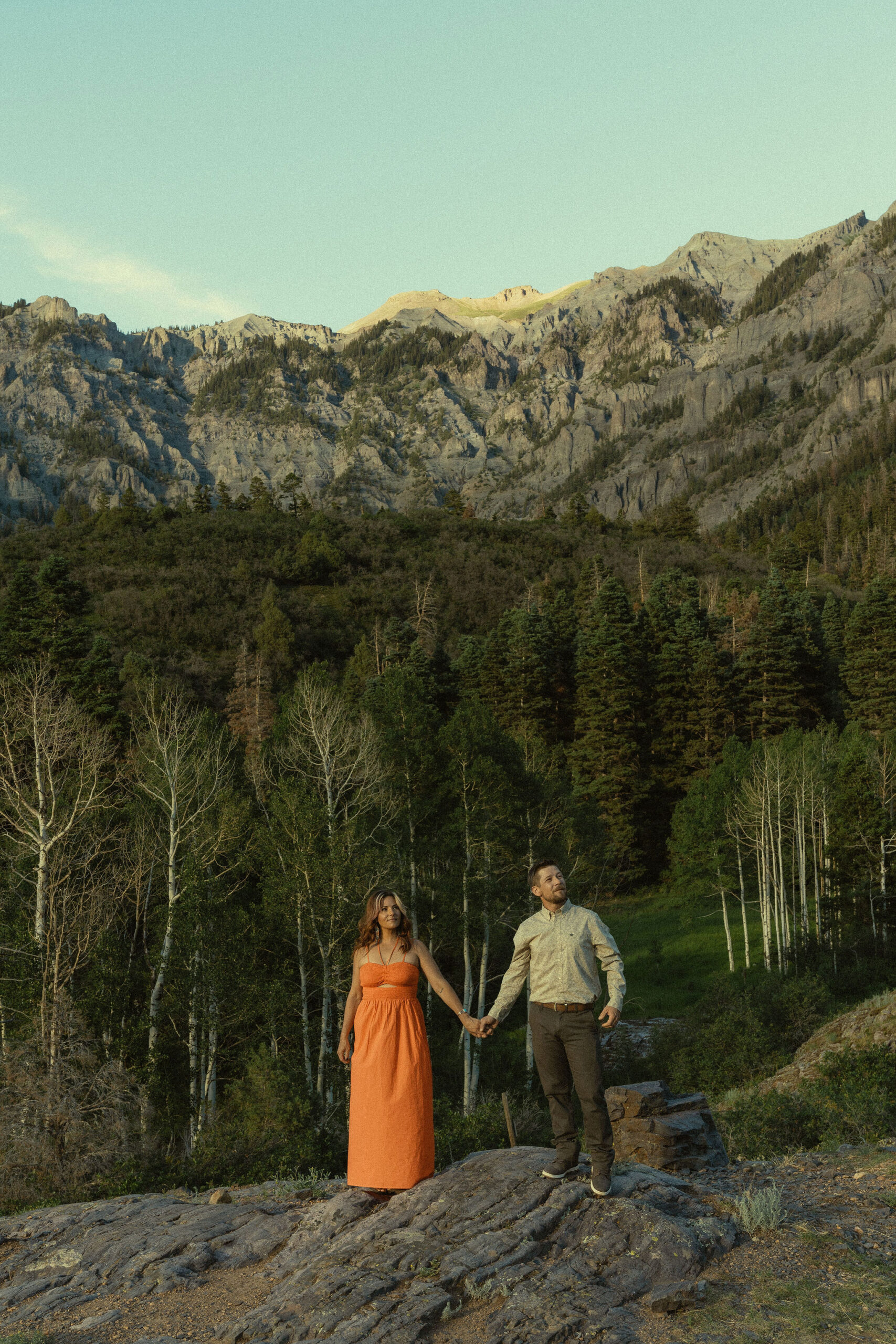 beautiful couple pose with the Rocky mountains outside Ouray, Colorado