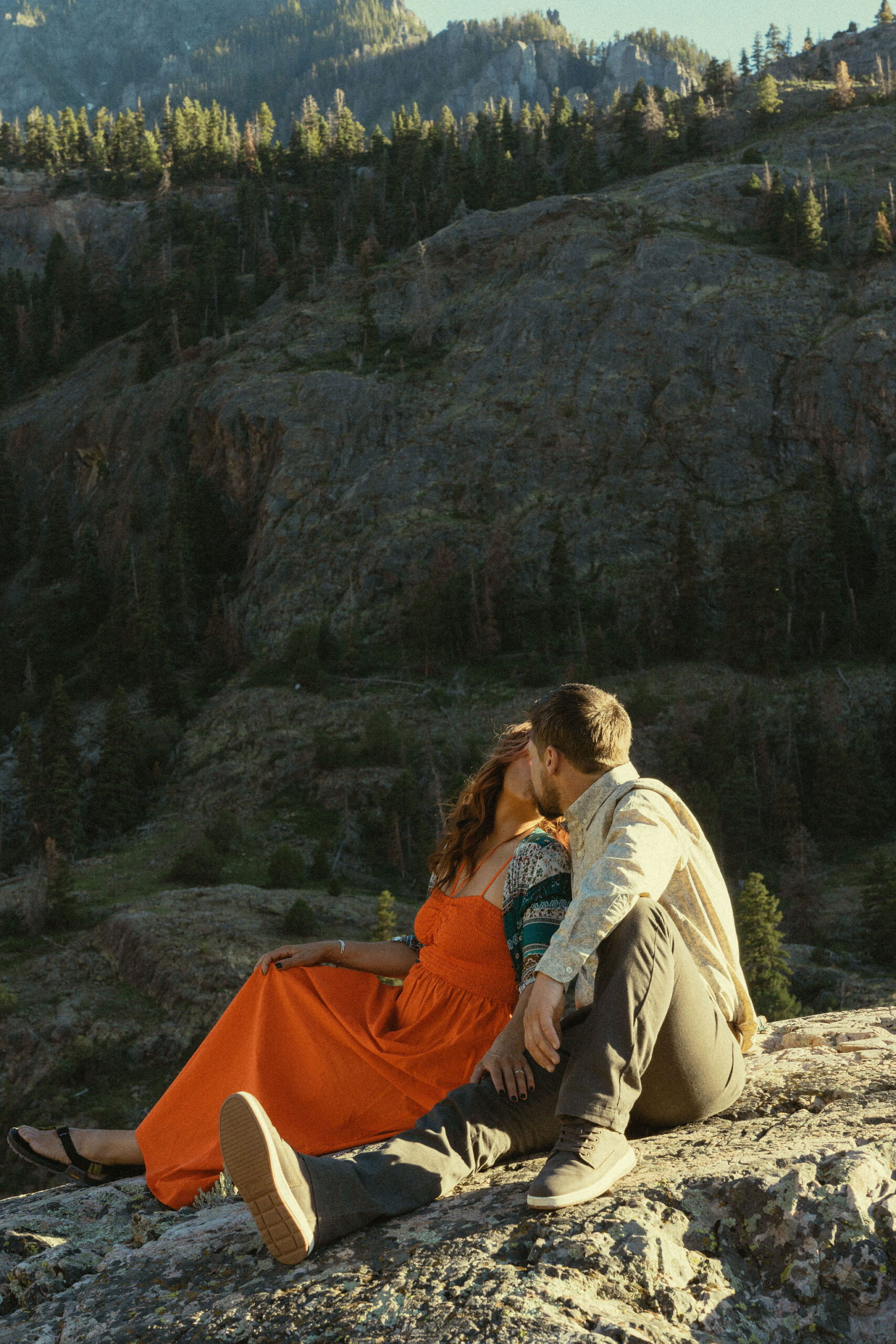 beautiful couple pose with the Rocky mountains outside Ouray, Colorado