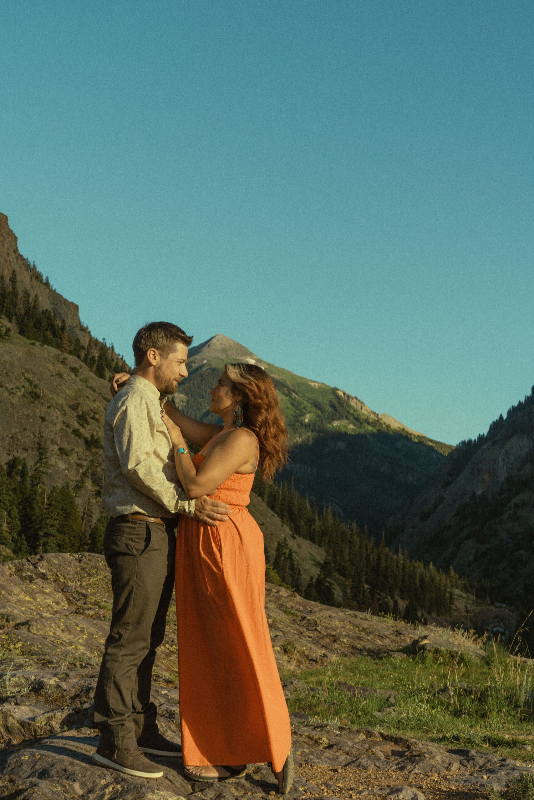 beautiful couple pose with the Rocky mountains outside Ouray, Colorado