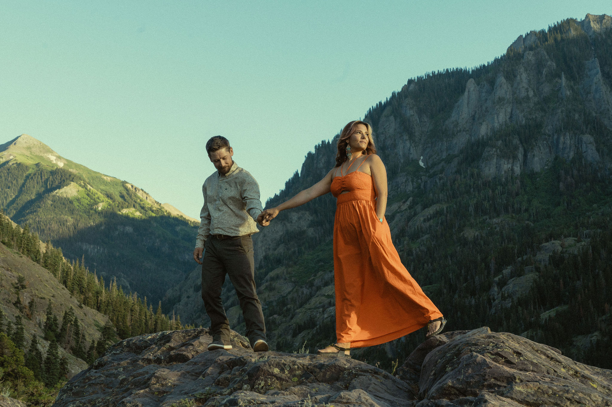 beautiful couple pose with the Rocky mountains outside Ouray, Colorado