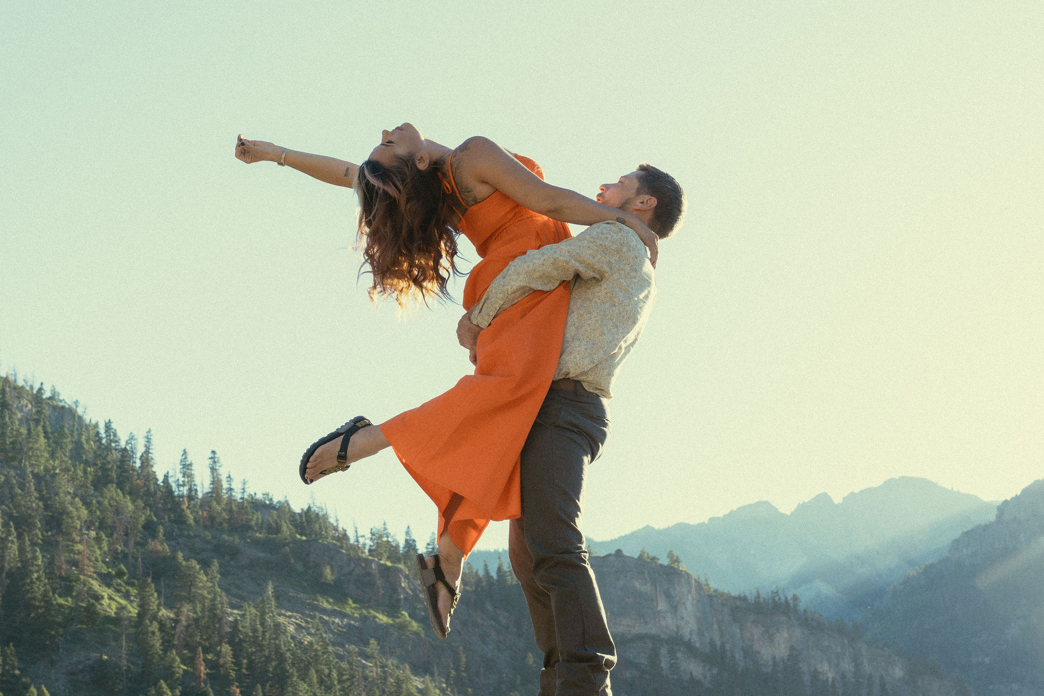 beautiful couple pose with the Rocky mountains outside Ouray, Colorado