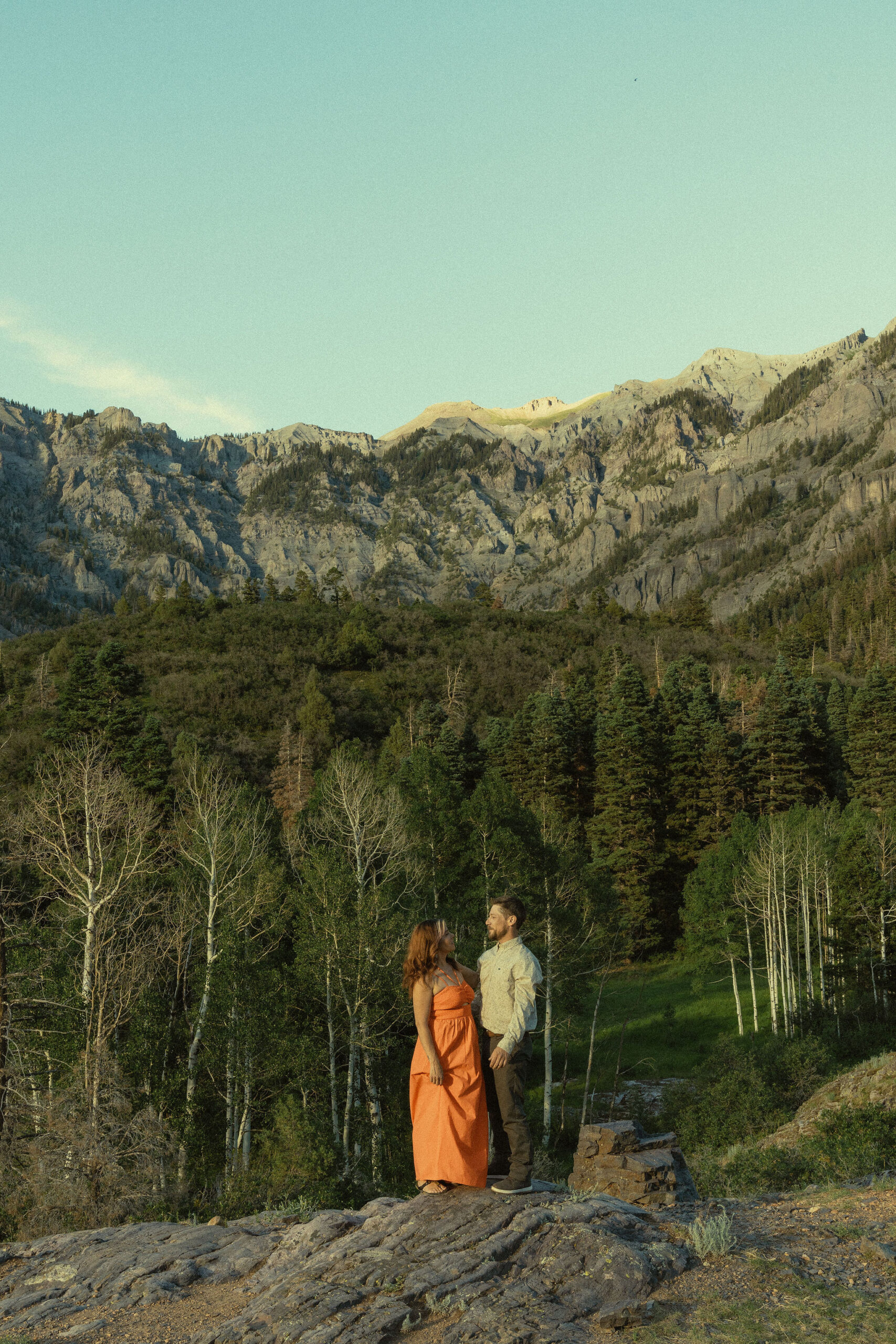 stunning couple pose together in the Colorado mountains