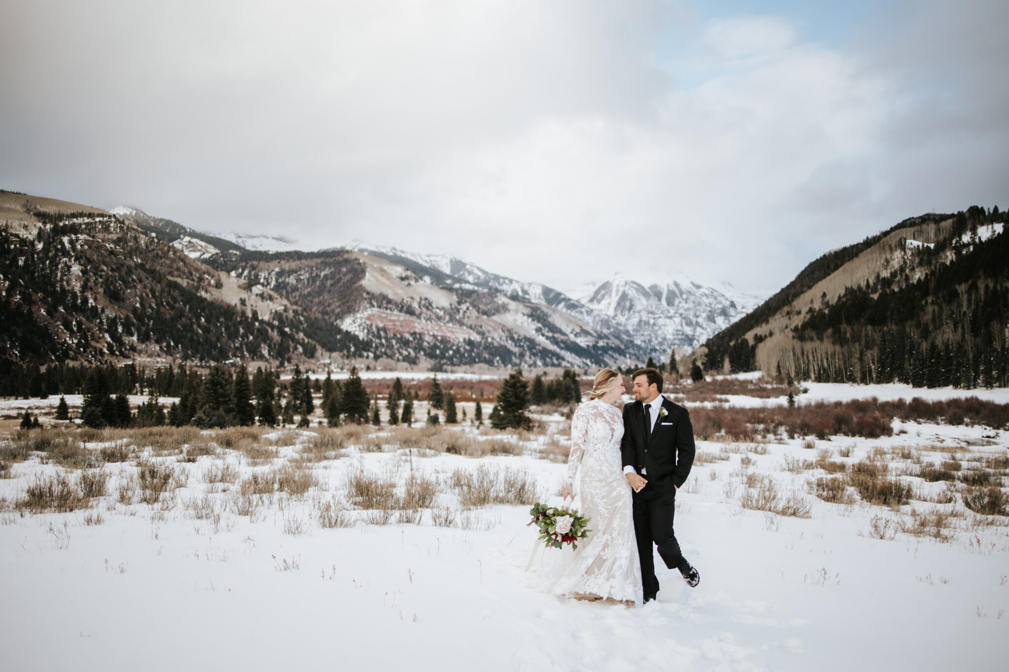 bride and groom pose in the beautiful Colorado nature 