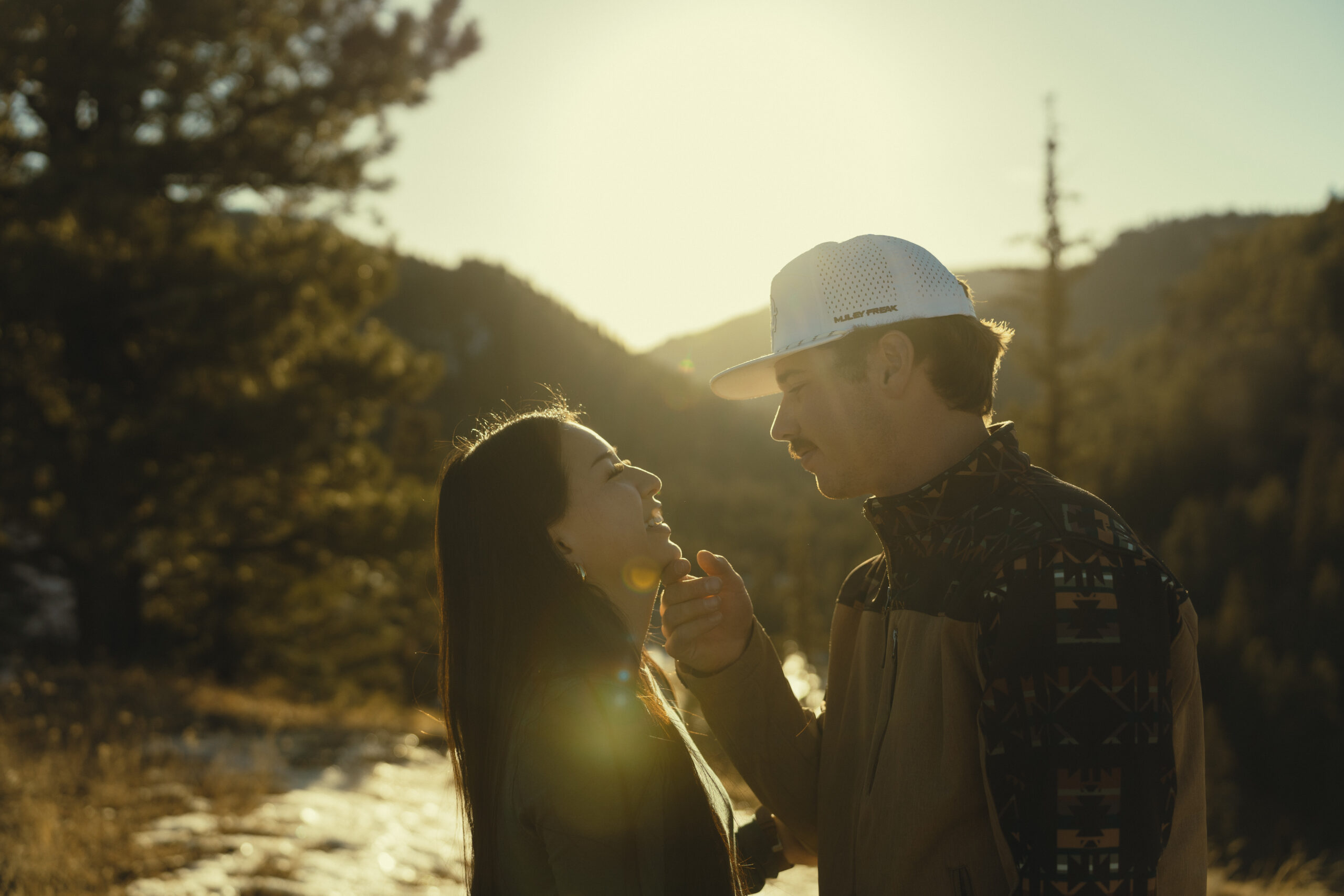 beautiful couple pose for a photo during their engagement session in nature