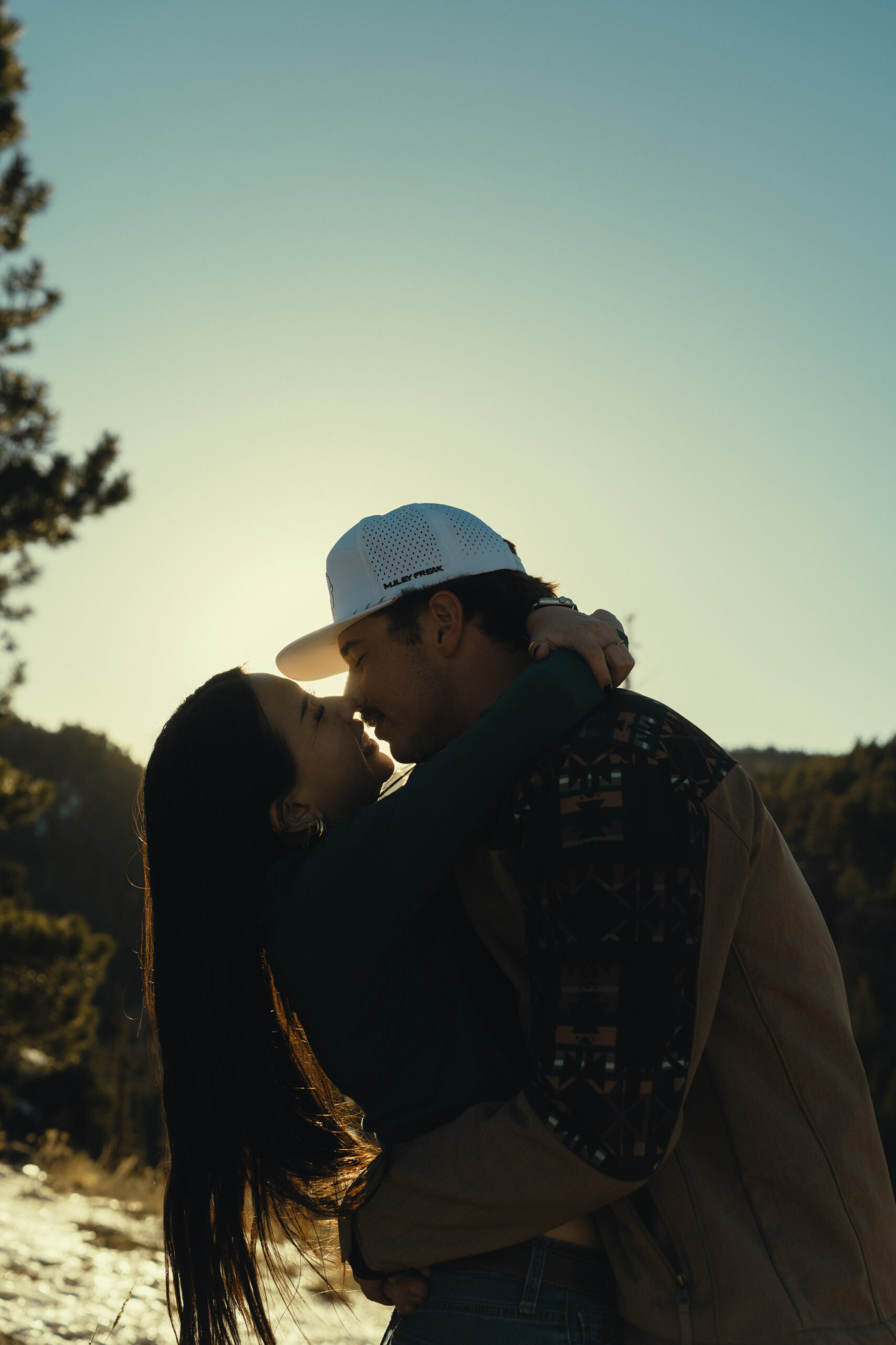beautiful couple pose for a photo during their engagement session in nature