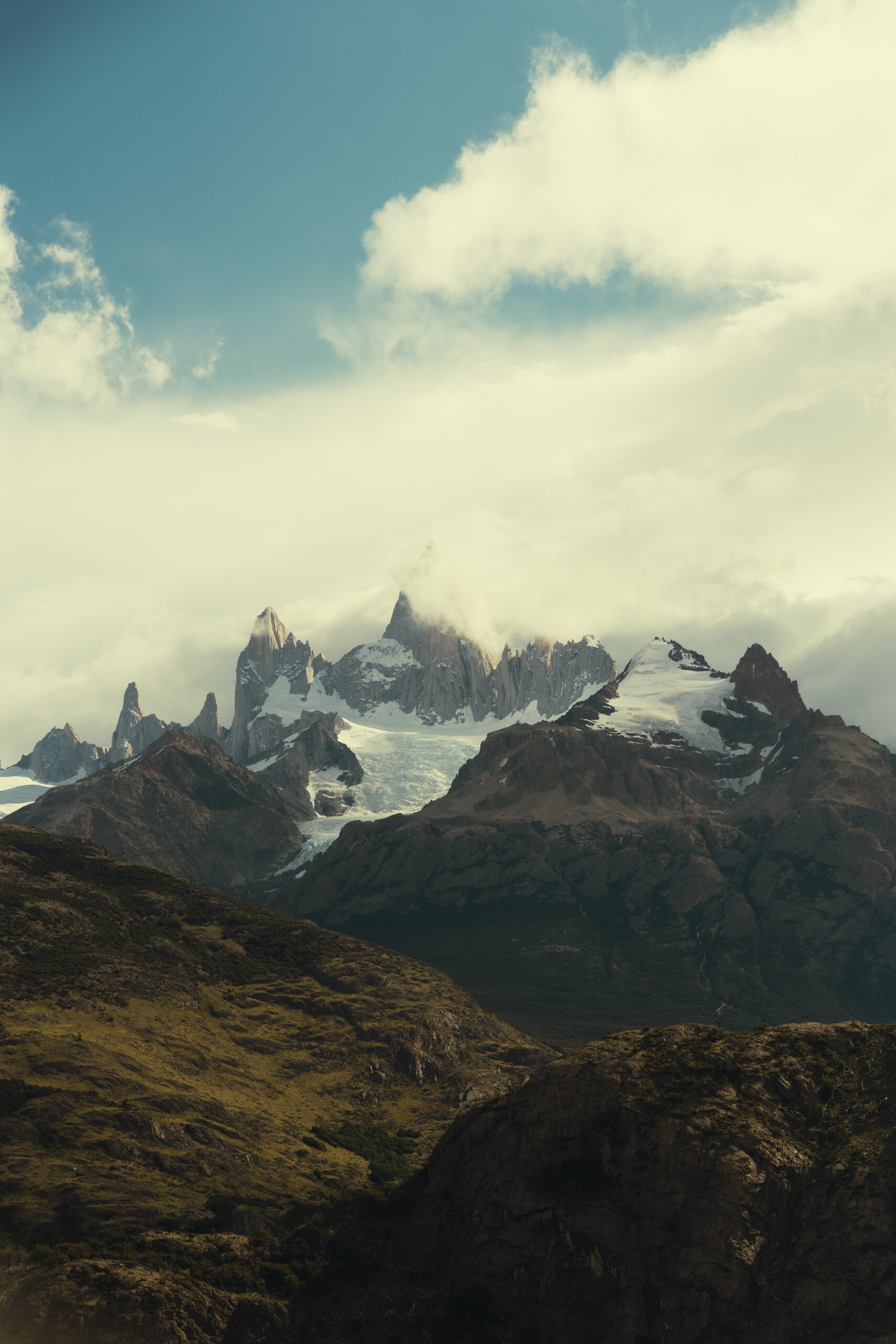 stunning mountains are surrounded by clouds