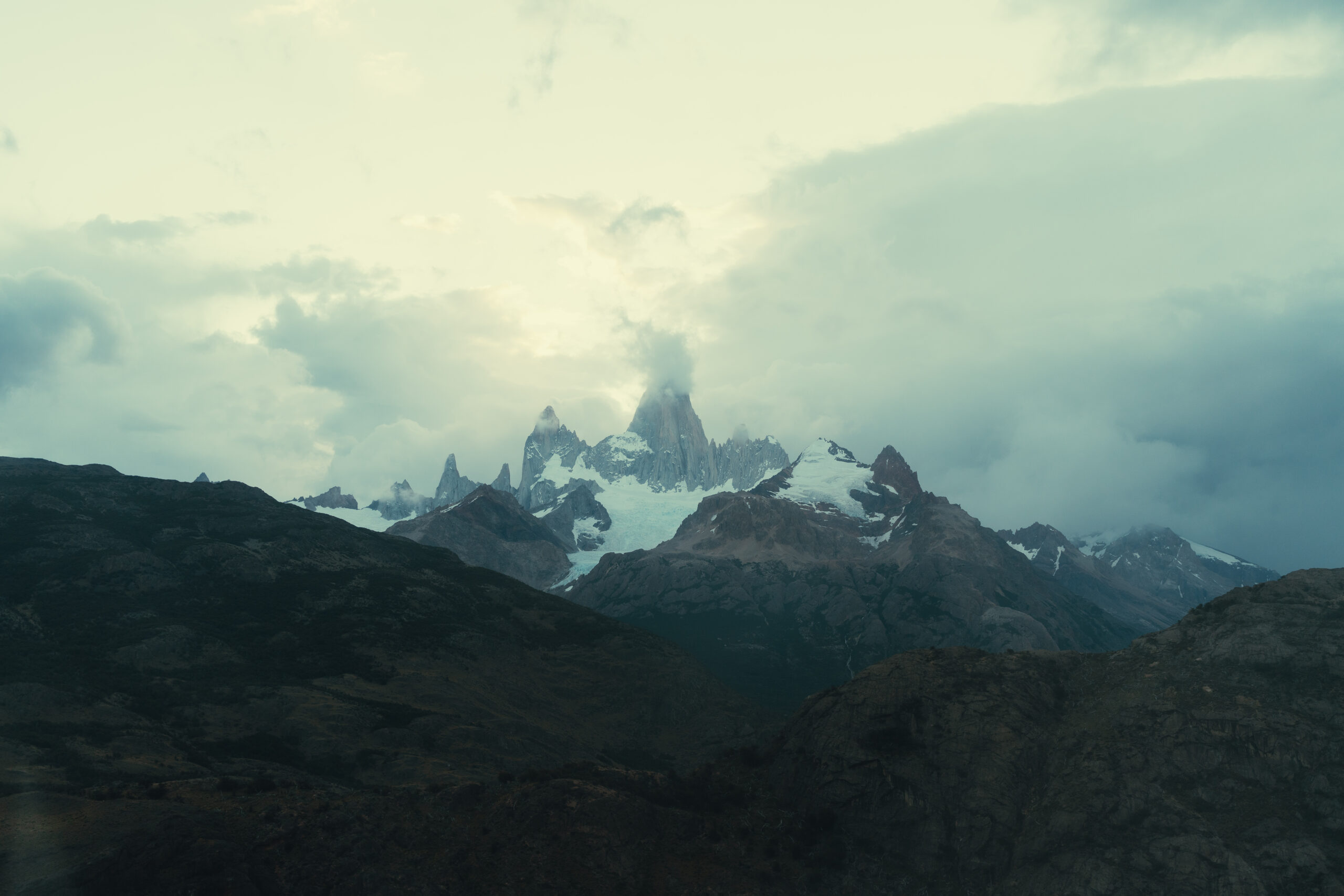 stunning mountains are surrounded by clouds