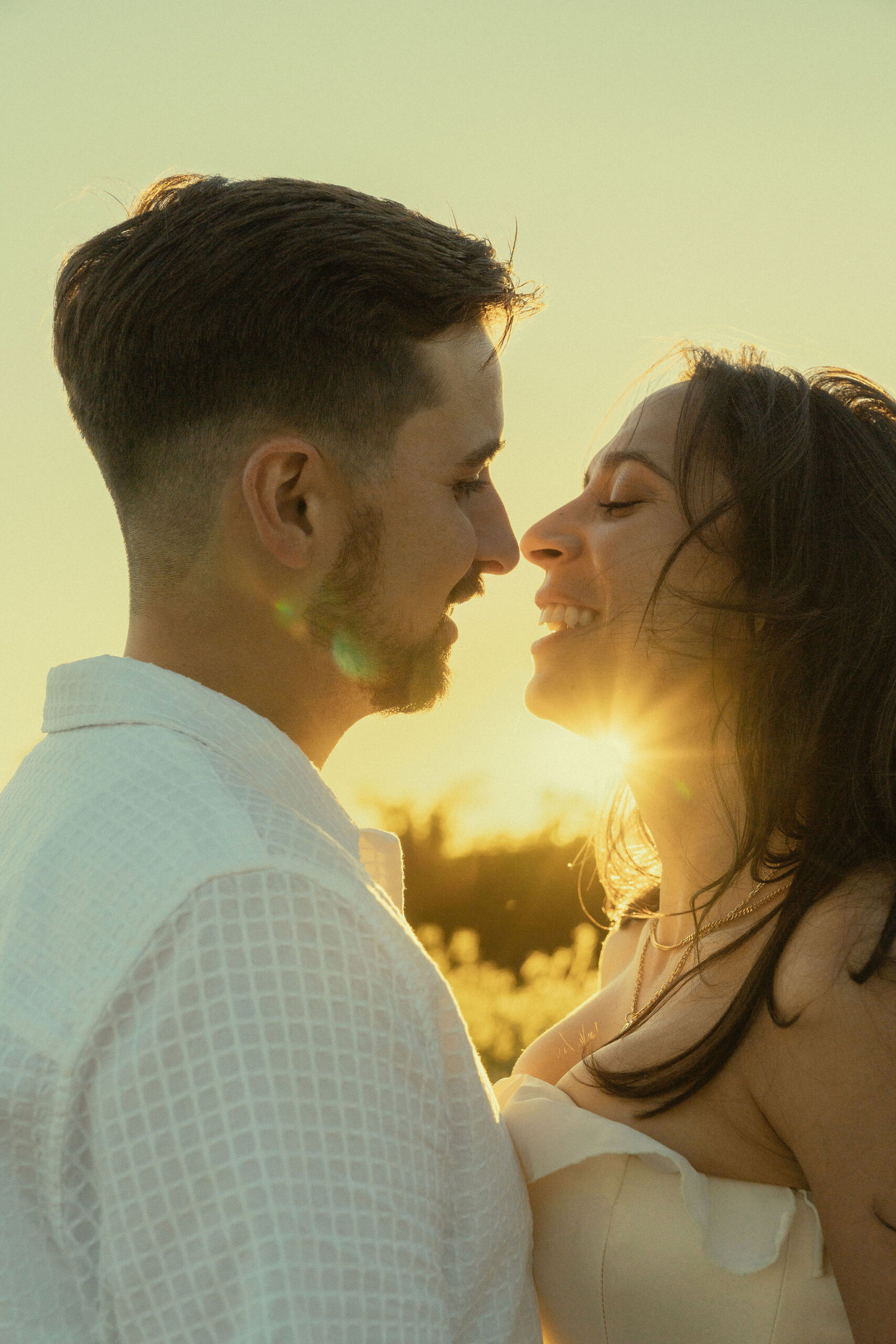 beautiful couple share an intimate moment during their engagement photoshoot with Sasha Takes Pictures