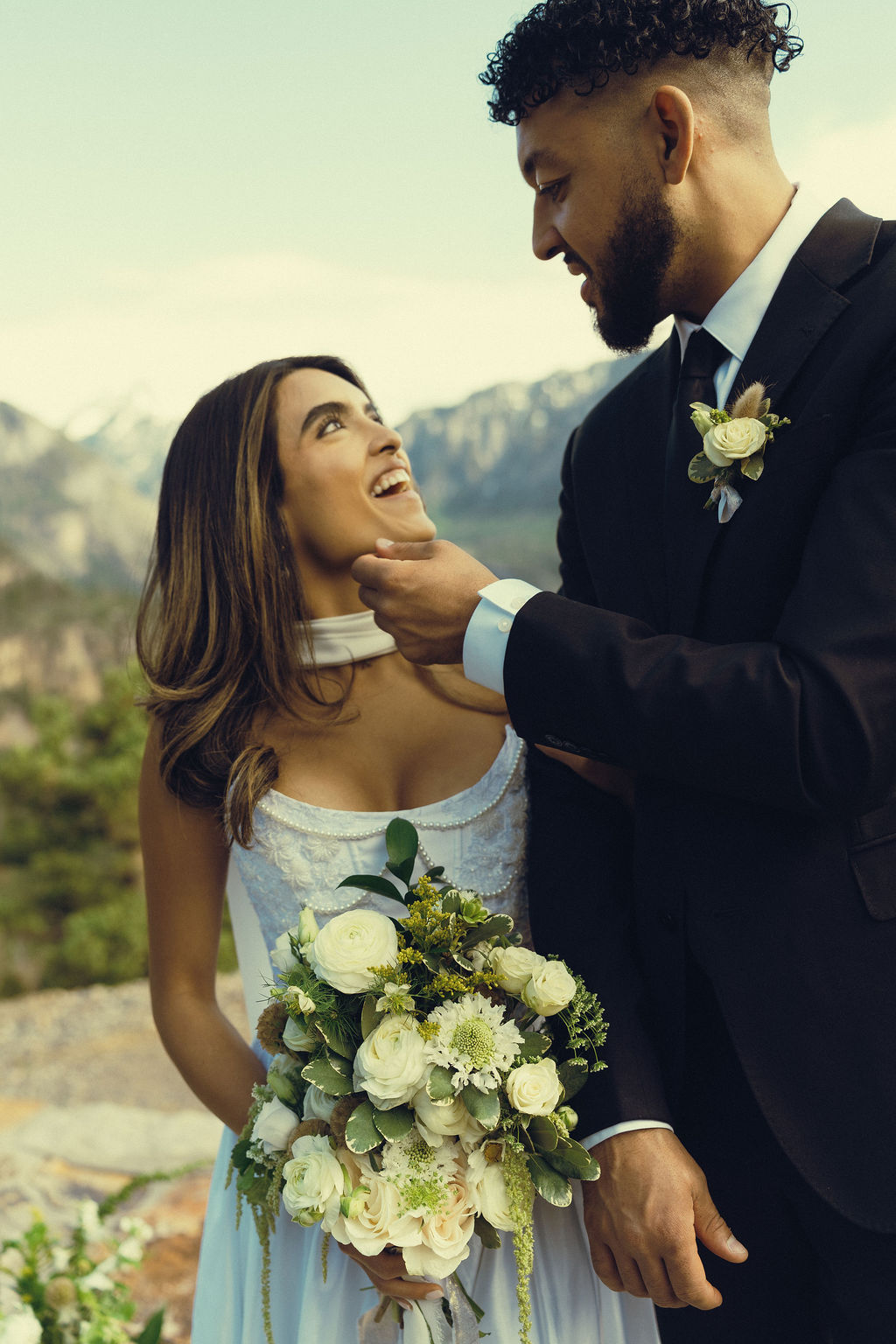 stunning bride and groom pose together during their Colorado wedding day