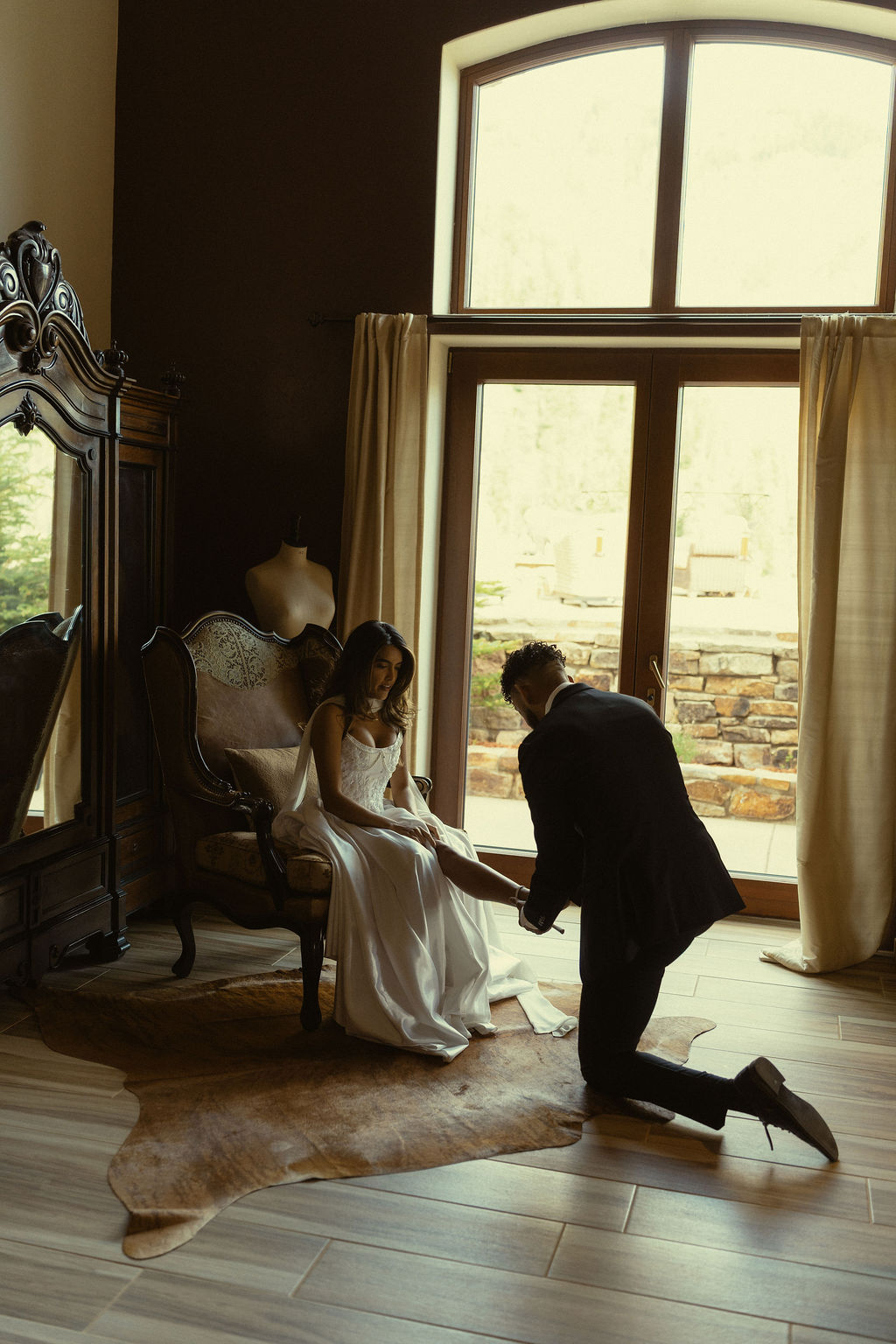 bride prepares for her stunning gold mountain ranch wedding in Colorado