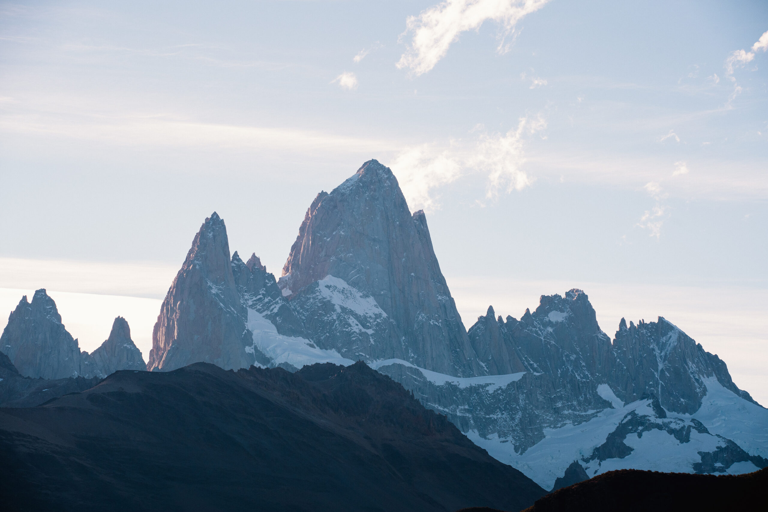 fitzroy sits high in the sky playfully touching the tip of the clouds