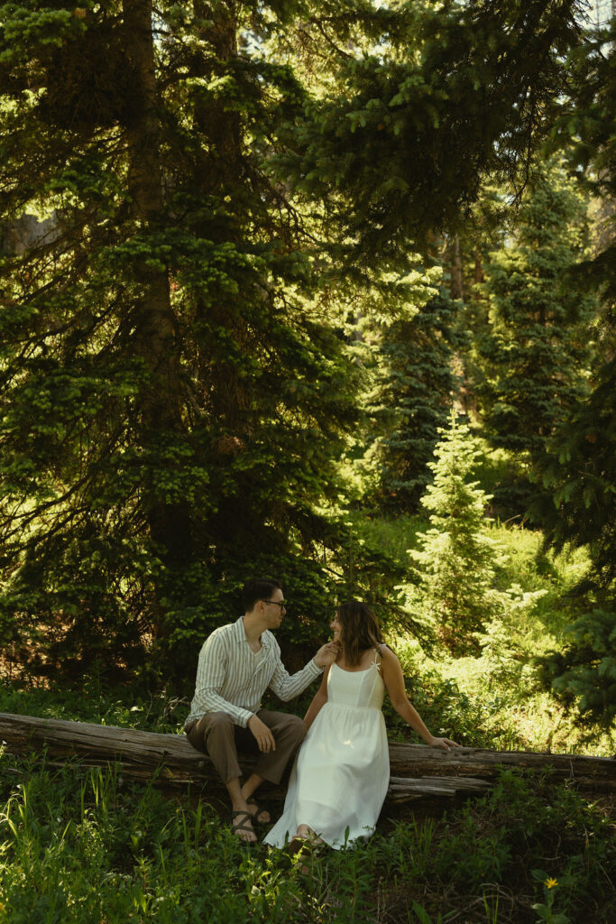stunning couple share intimate moments in the woods during their engagement photos in Durango