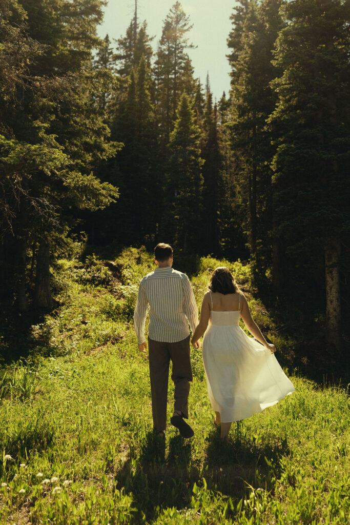 stunning couple share intimate moments in the woods during their engagement photos in Durango