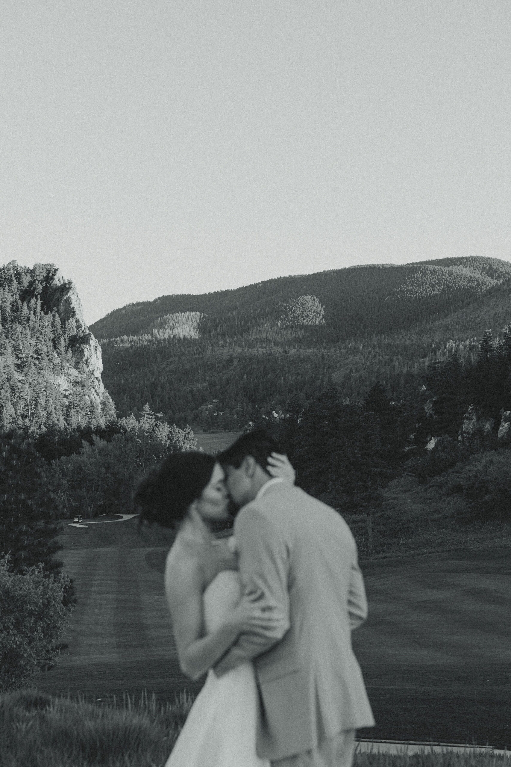 bride and groom share an intimate moment during their Perry Park Country Club wedding