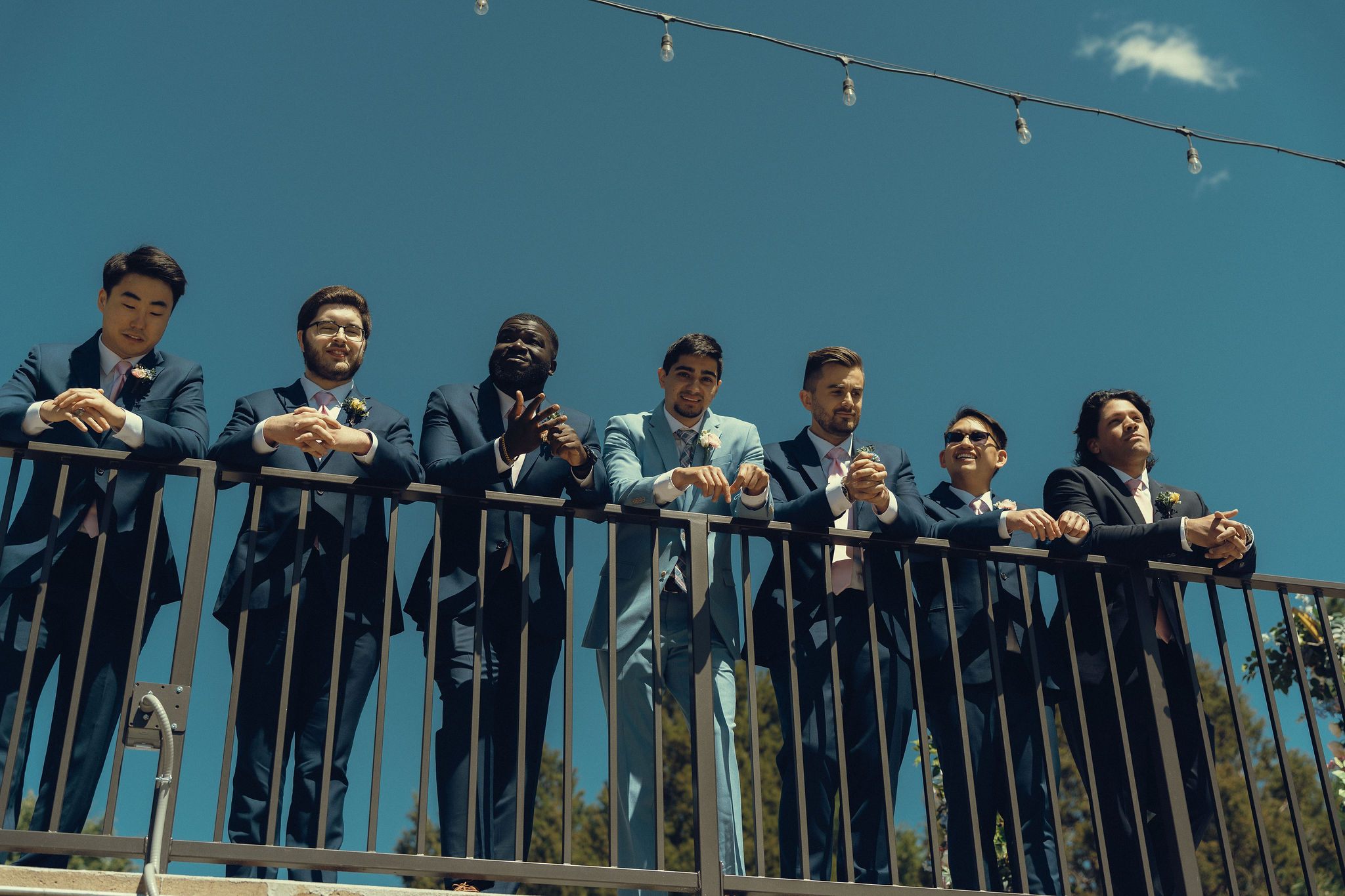 groomsmen pose with the groom ahead of the country club wedding day