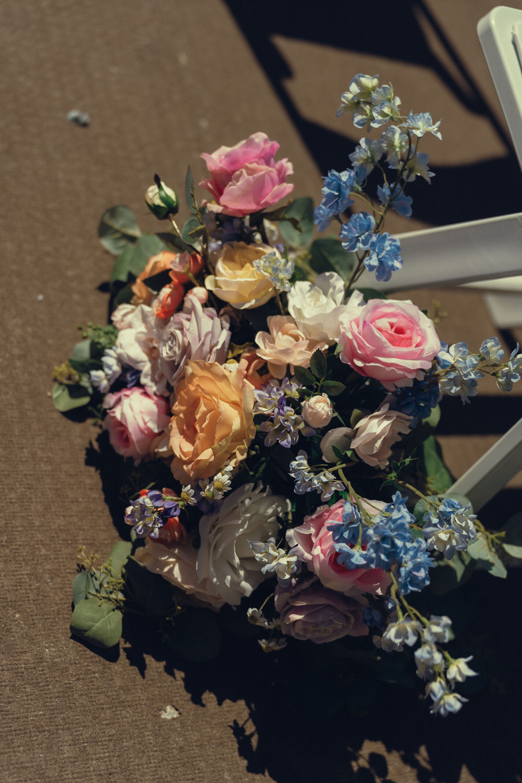 stunning pink, blue, and orange wedding florals bring such a bright splash of color to the Country club wedding day