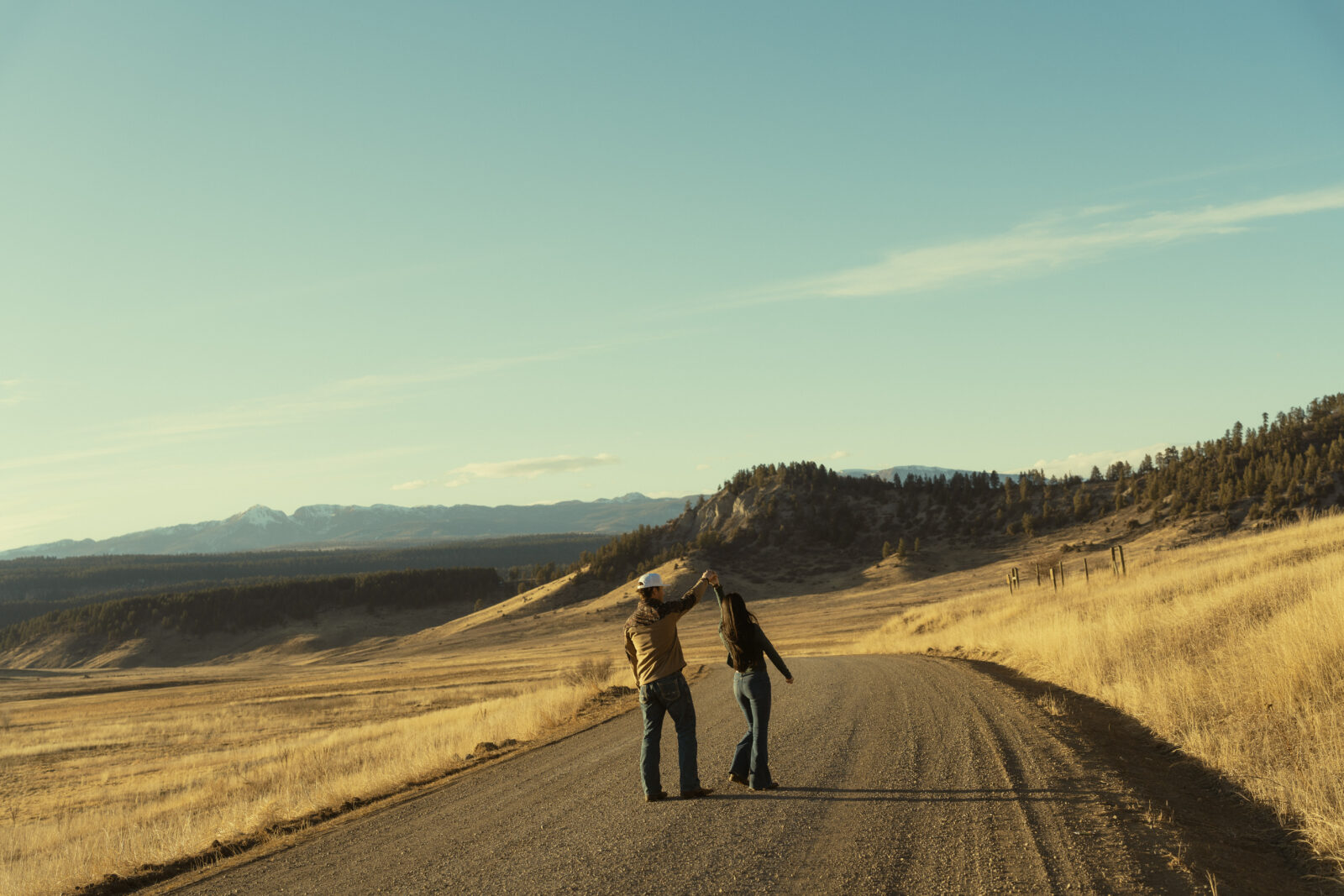 stunning couple share an intimate moment during their mountain engagement photos