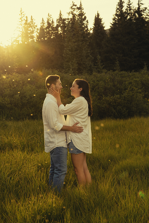 couple take candid photos together in the beautiful Colorado nature 