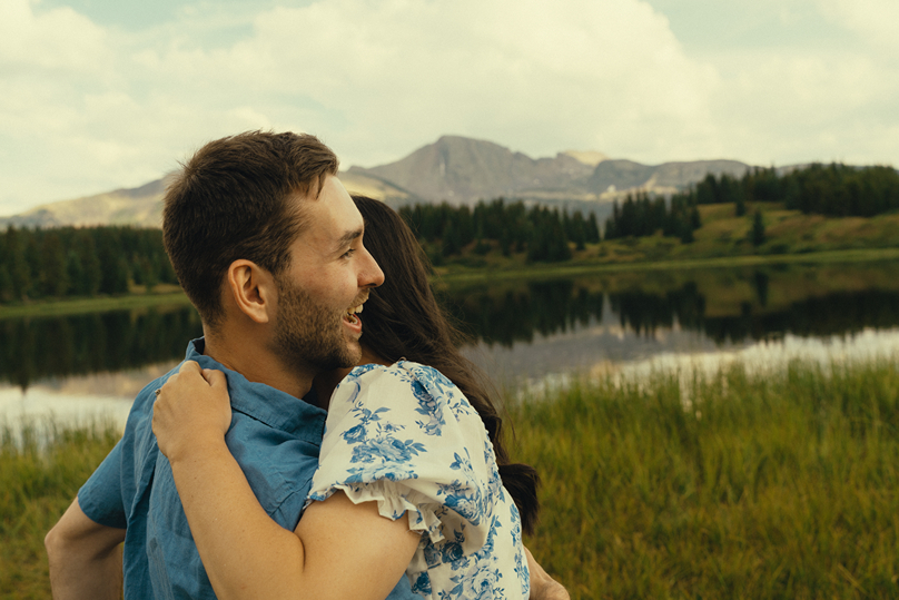 stunning couple share romantic moments near Molas lake during their Colorado engagement session