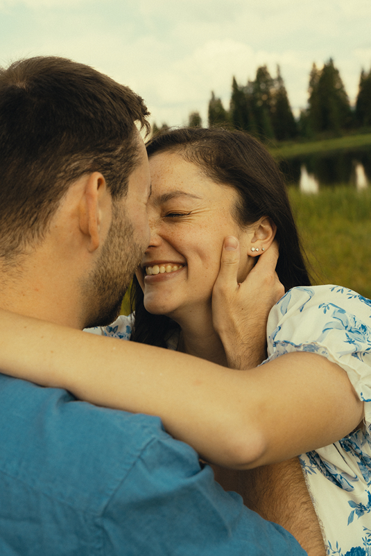beautiful couple share a kiss during their cinematic Colorado engagement session