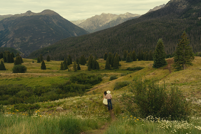 stunning couple share an intimate moment during their mountain engagement photos