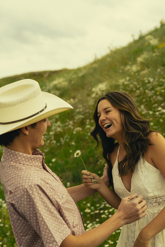 stunning couple share an intimate moment during their mountain engagement photos