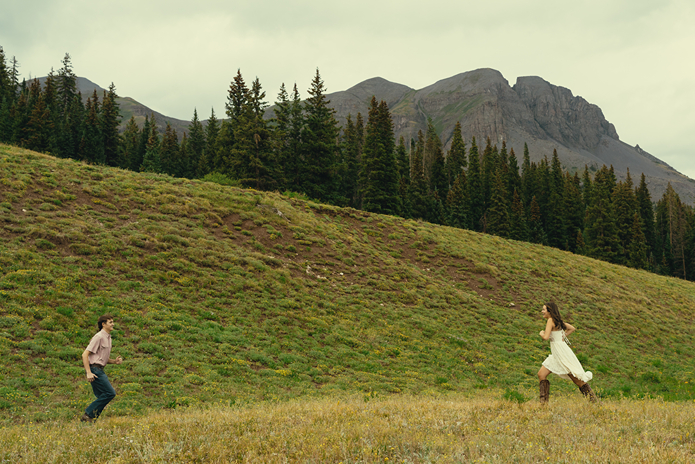 couple run together in the Colorado nature together