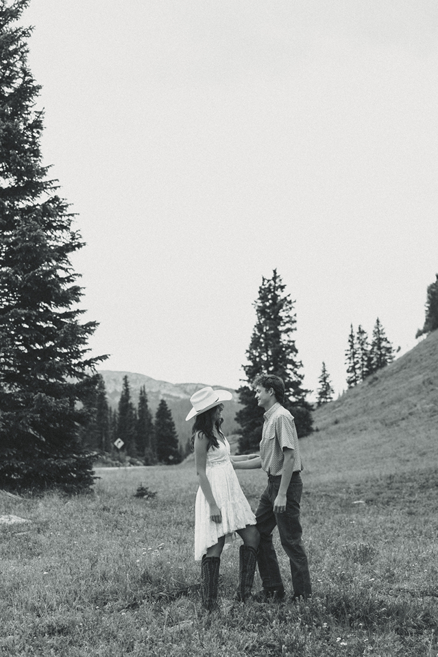 beautiful couple pose in the Colorado nature during their engagement photos
