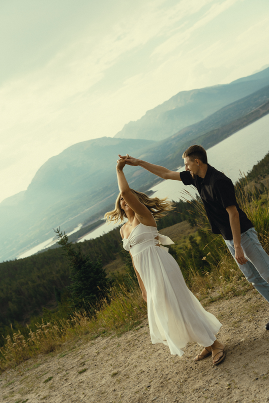 couple dances together with the Colorado nature in the background