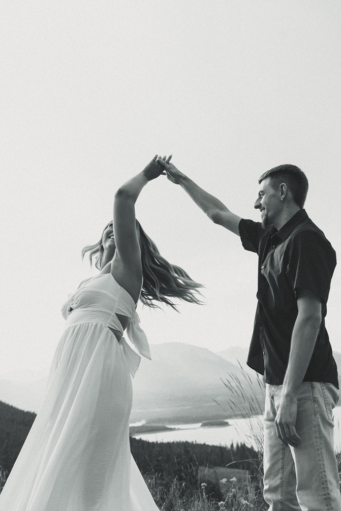 couple dances together with the Colorado nature in the background