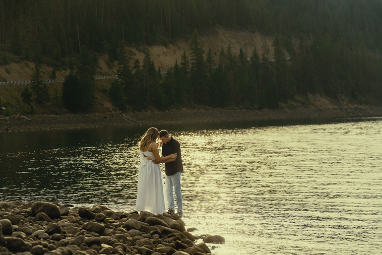 stunning couple pose together near Dillon Lake in Colorado during their Lake Dillon engagement photos