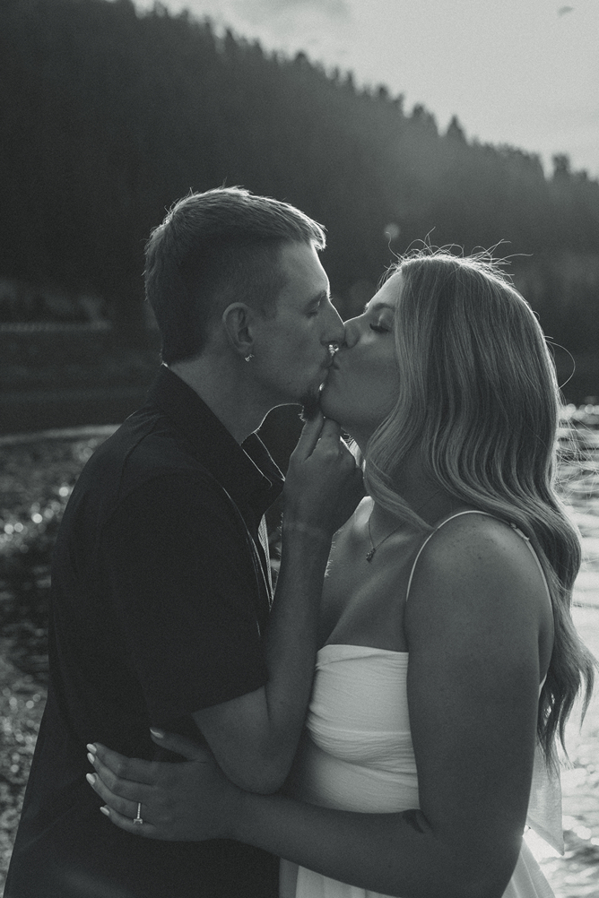 stunning couple pose together near Dillon Lake in Colorado during their Lake Dillon engagement photos