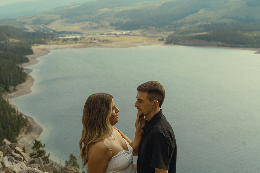 stunning couple pose together near Dillon Lake in Colorado during their Lake Dillon engagement photos