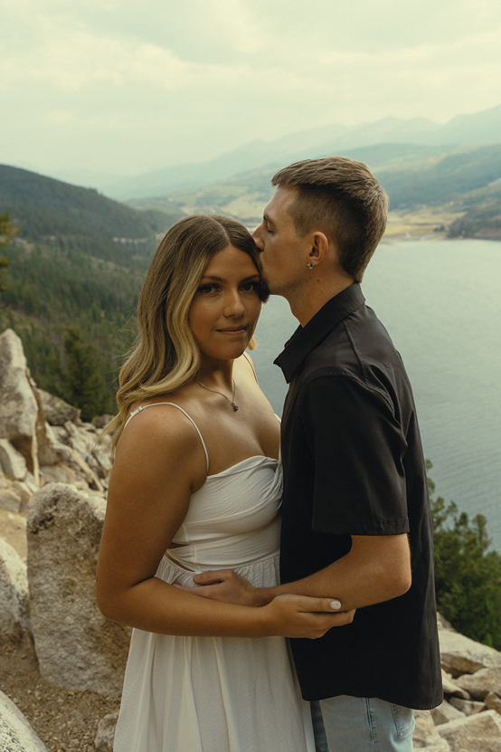 stunning couple pose together near Dillon Lake in Colorado during their Lake Dillon engagement photos