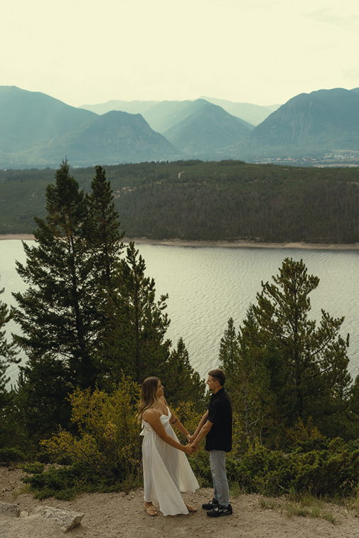 stunning couple pose together near Dillon Lake in Colorado during their Lake Dillon engagement photos