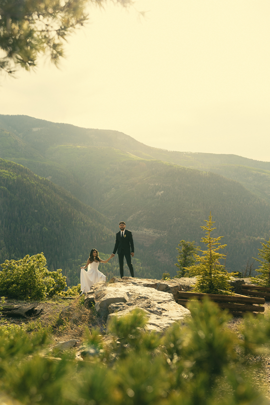 beautiful bride and groom pose in the San Juan mountains on their elegant elopement day