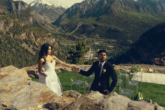 beautiful bride and groom pose in the San Juan mountains on their elegant elopement day