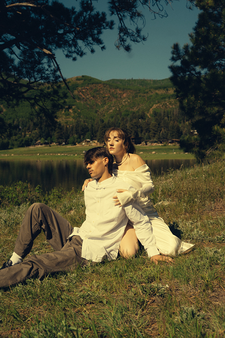 bride and groom pose by the lake during their Durango Colorado wedding portraits