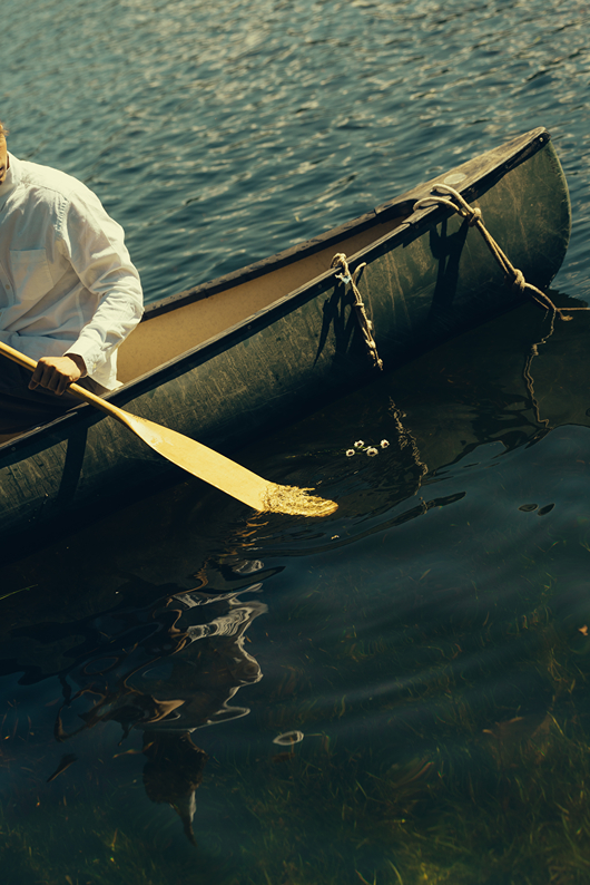 bride and groom ride in the canoe together during their Colorado elopement