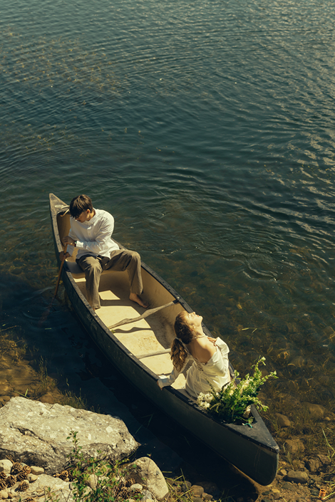 bride and groom ride in the canoe together during their Colorado elopement