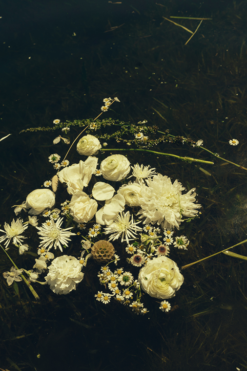 brides flowers float in the lake