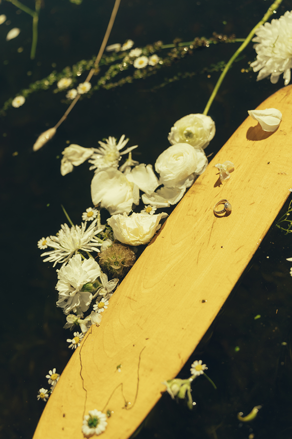 brides flowers float in the lake