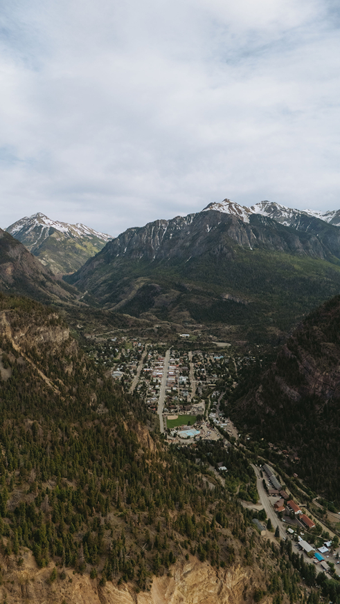 stunning view of a colorado town nestled in the mountains captured by Sasha Takes Pictures drone