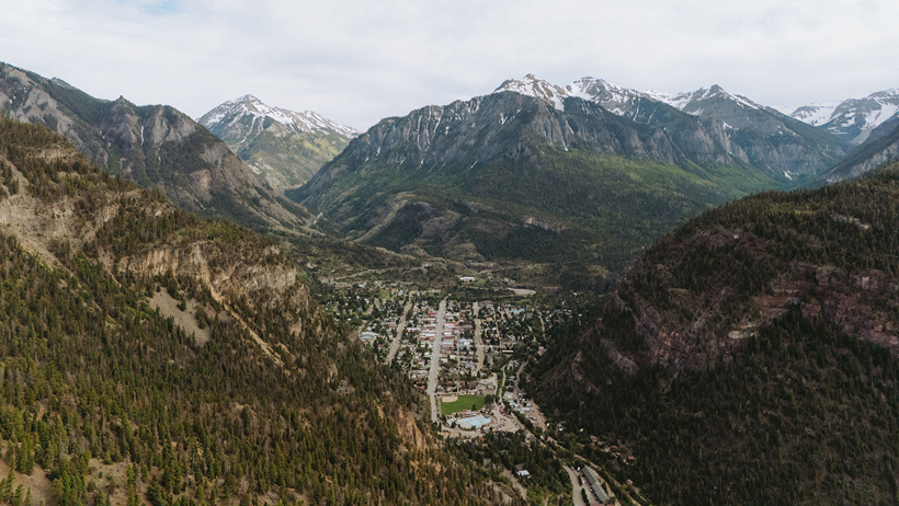 stunning view of a colorado town nestled in the mountains captured by Sasha Takes Pictures drone