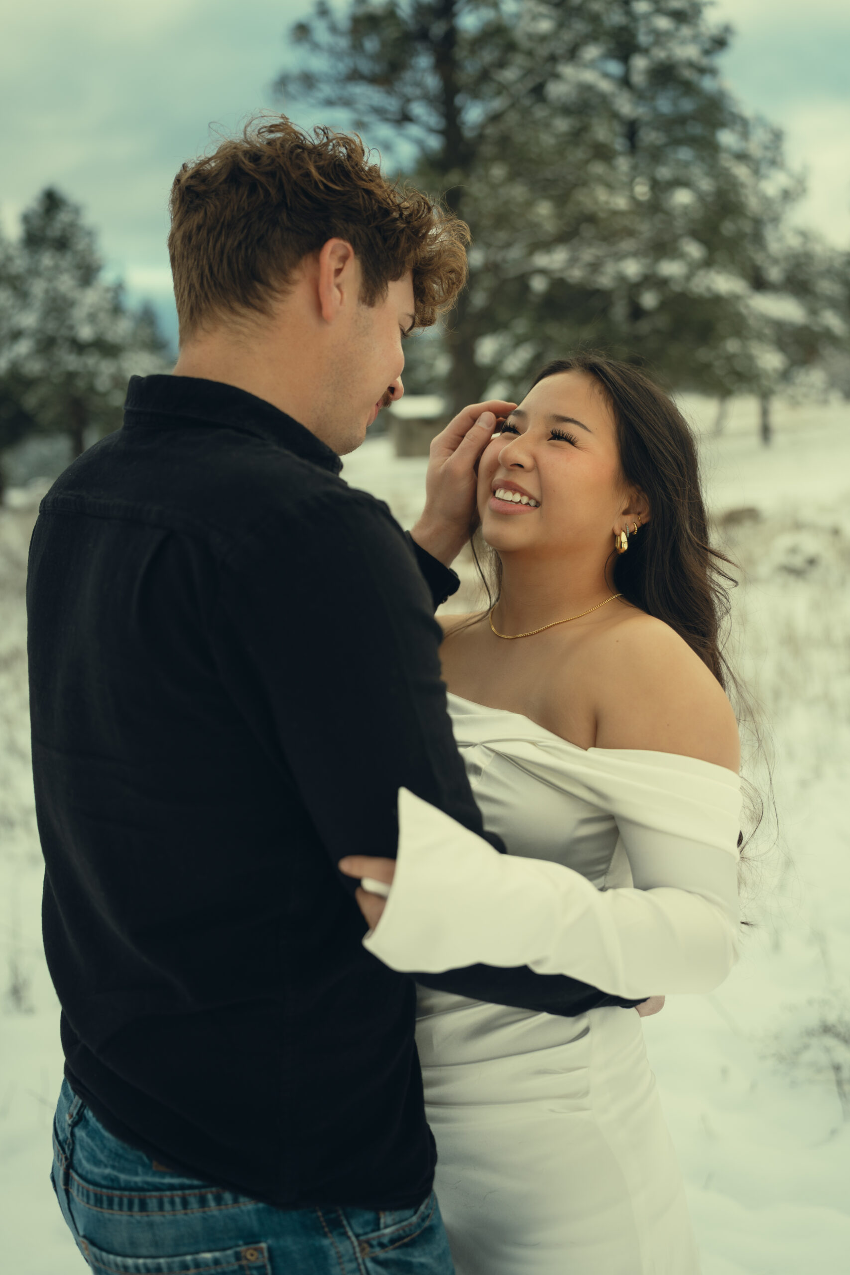 stunning couple pose in the winter snow one of the top reasons to elope in Colorado