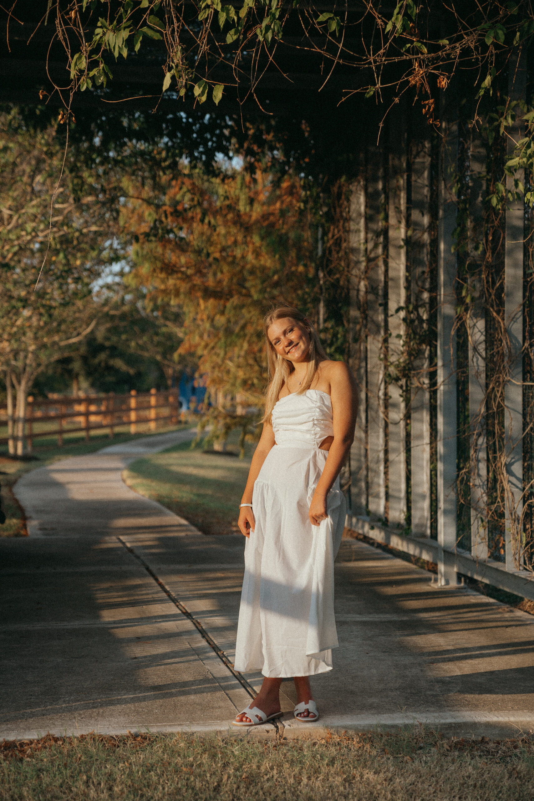 senior poses during her photoshoot with Sasha
