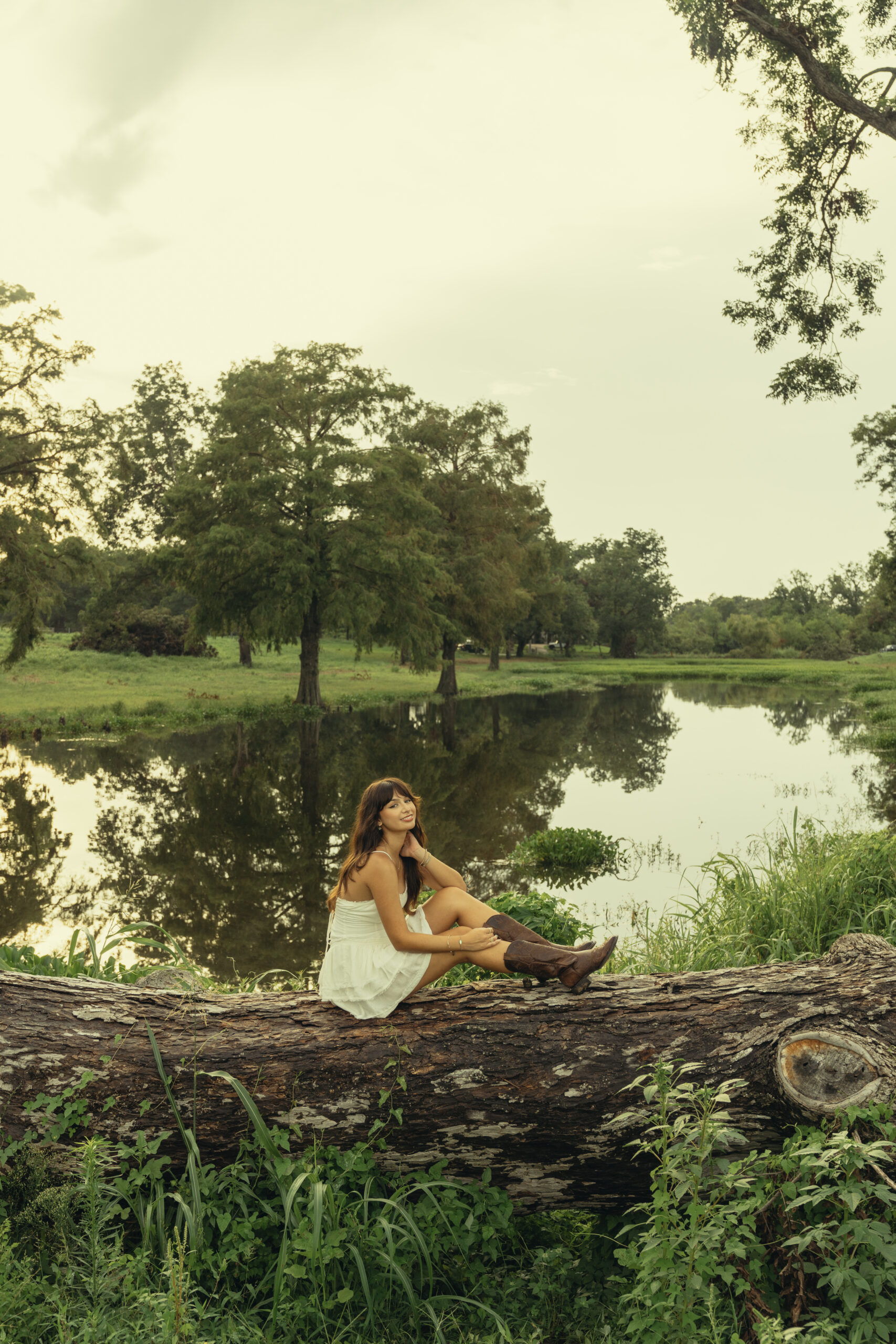 senior poses during her photoshoot with Sasha